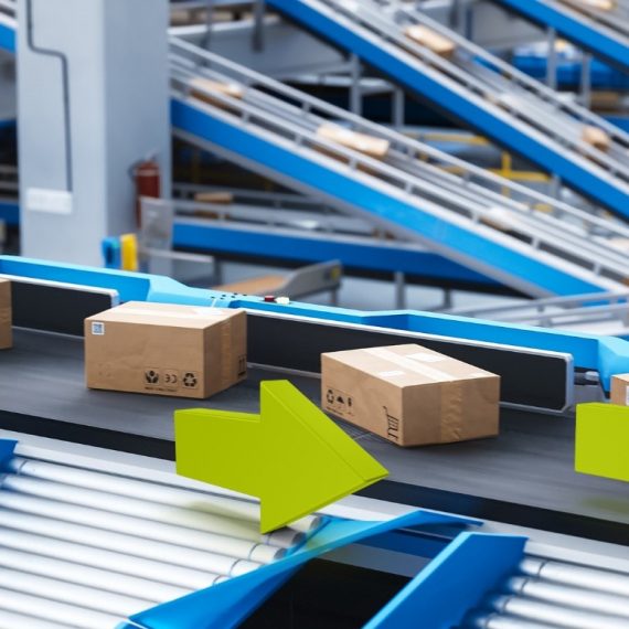 Modern warehouse showcasing automated material flow systems like ASRS and conveyors, symbolizing increased efficiency, margin growth, and operational control.